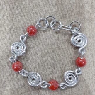 Bracciale artigianale spirali e pietre rosse ceramica