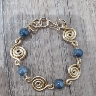 Bracciale dorato pietre scure gr12