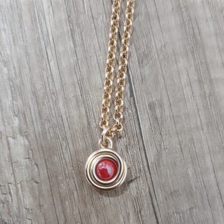 Collana artigianale spirale pietra rossa