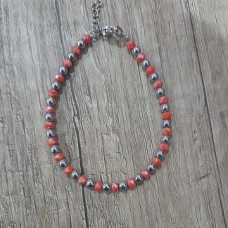 Bracciale artigianale con ematite e vetro arancione